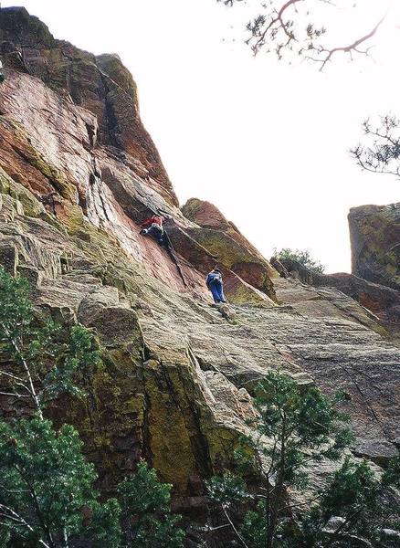 Joseffa Meir leads up into the crux of "Three Old Farts Young At Heart (10d)" on Eldo's Redgarden Wall. Kre belays. Photo by Tony Bubb 4/'07.
