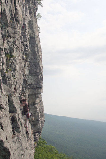Alex cleans up the first pitch of Something Interesting. What fantastic face climbing!