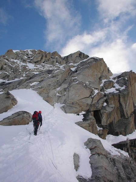 Andy Grauch midway up the first rock pitch on the southwest ridge of peak 11,300, while Ty Cook simul-climbs.