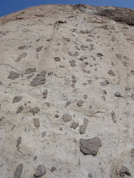 Follows the bolt line through the spots. The first anchor is hidden; it lies just left of the upper brown area (Sierra Club Route) on a sloping shelf. The second pitch starts up and left from there and finishes well above the anchors for the central routes to the left.