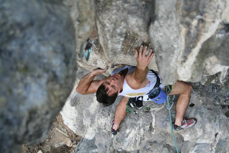 Tony Bubb heading up on the off-angled holds of 'Circumcision (6b)' at Nanyang Wall, in the Batu Caves area of K.L., Malaysia. Photo by Kenny Low, December 2006.