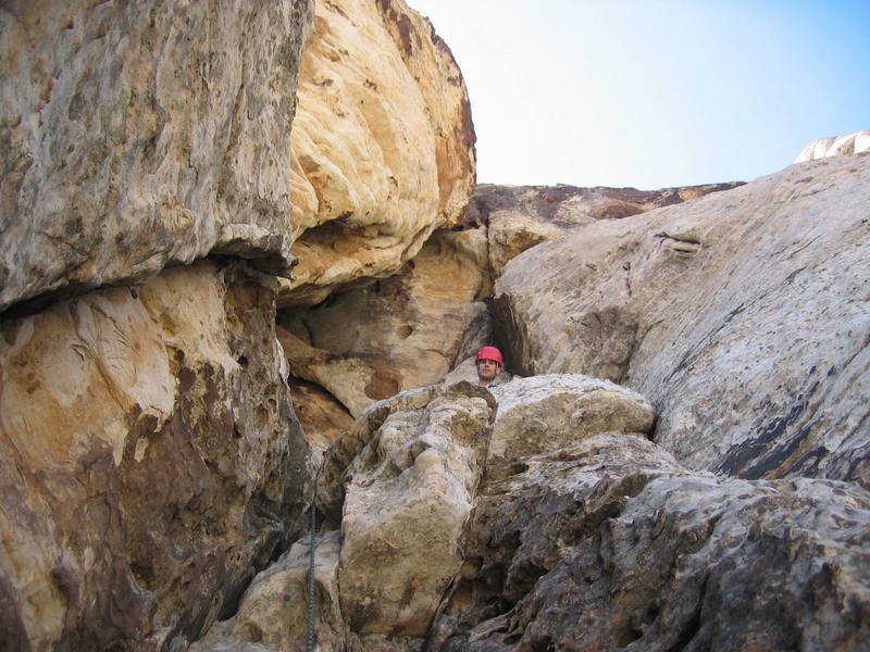David Andretta looking over the ledge. This was the one with the puddle of pee from pretty much every one that has climbed the route.