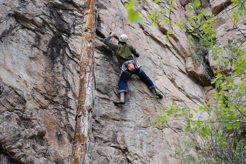 Moving towards the jug at the crux.