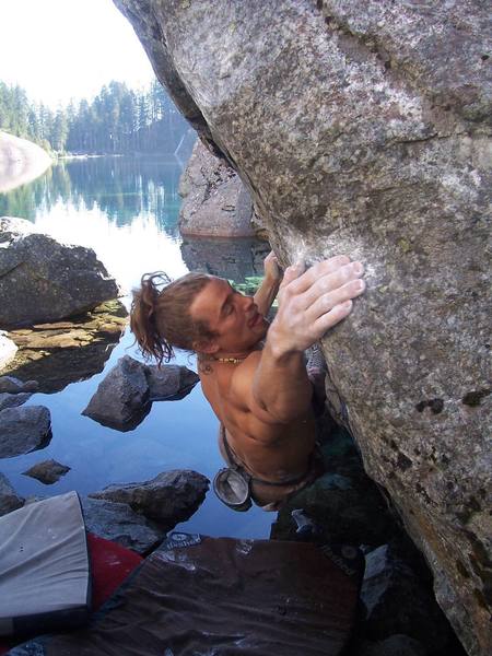 Cole Allen on the first ascent of The Token (V7), Lake Serene, WA.