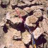 The upper pitches of Rap Rock can be well protected with slings, should you care to bother. The puzzle peice rock there can be tied off, slung, girthed, etc... Photo by Tony Bubb, 2001.