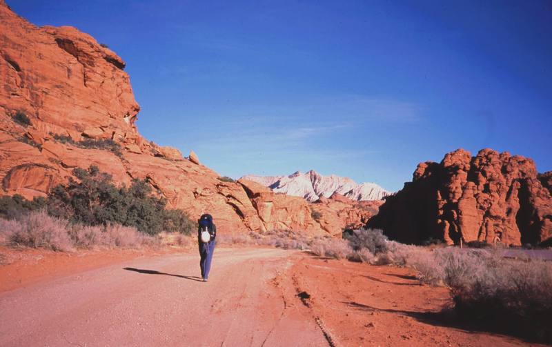 Joseffa Meir walks in to Snow Canyon for a cold morning of climbing. Photo by Tony Bubb, 11/03.