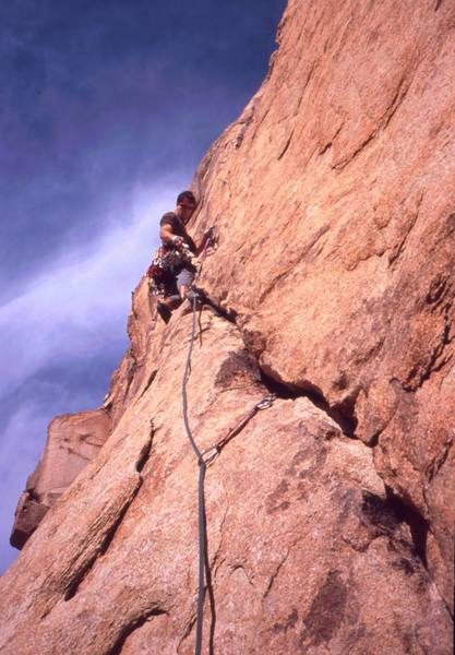 Tony Bubb at the rest stance before the traverse move crux of 'Cakewalk' (5.9), at Freeway Wall. Photo by Chris Parks, 3/04.