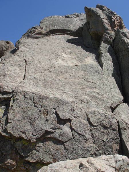 The right side of Skyy Slab.  A Midsummer's Night Seam (5.7) works the plates to the seam on the left, finishing up past delicate slab moves.  Firewater (5.5) can be seen following the bolt line in the right center part of the photo.