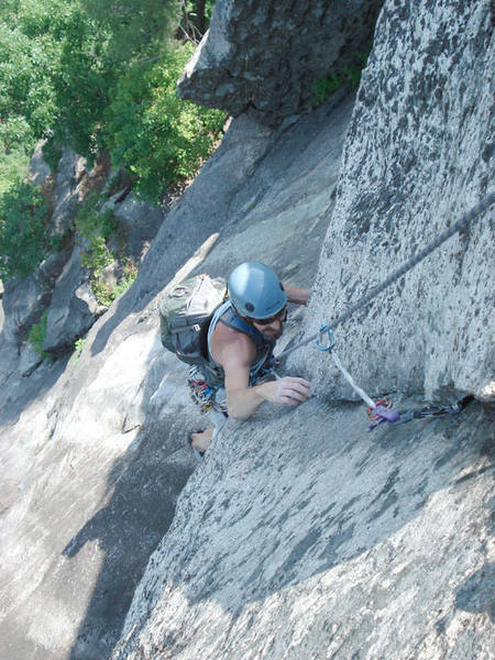 My dad cleans the first piece in the super exposed crux....