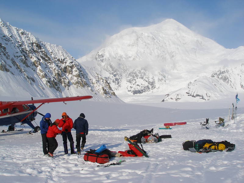 Day 1 of your trip, on the ground at Kahiltna Base Camp, 7,200 feet on the Southeast Fork of the Kahiltna Glacier. Looking down the landing strip toward the main Kahiltna Glacier. Mount Crosson is the peak in the background. You begin your trek up the West Buttress by walking down the hill - it's called "Heartbreak Hill" for the experience that you'll have on the way back up at the end of your trip - and turning right to begin the slog up the Kahiltna Glacier.