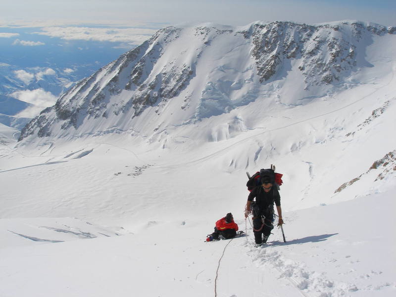 A view from the West Rib cutoff of the West Buttress boot track, from Windy Corner (left) to the camp at 14,000 feet (center), to the fixed lines below 16,000 feet (right).