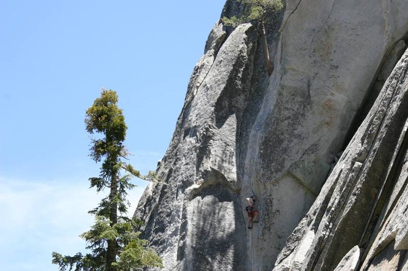 Climbing the finger cracks on the lower section.