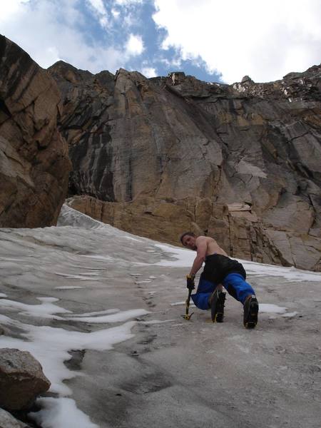 Eric B ascends the ice/snowfield approach to McHenry's Notch Couloir.