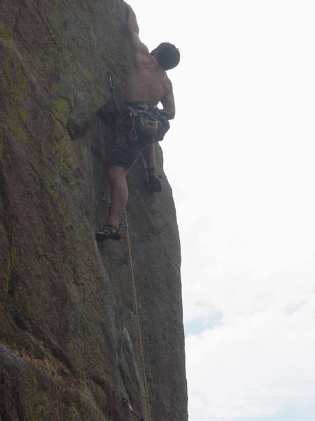 Shaun Reed making the long reach on the lower crux.