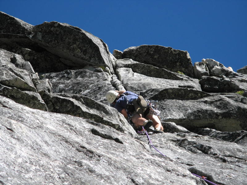 Brett placing some pro before attempting the crux bulge section on the 2nd pitch