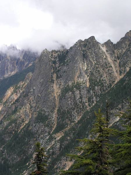 Petit du Cheval is the formation on the left and 5.8 route named Spontaneity Ridge follows the right edge of the formation just left of the rock slide gully (8/04).