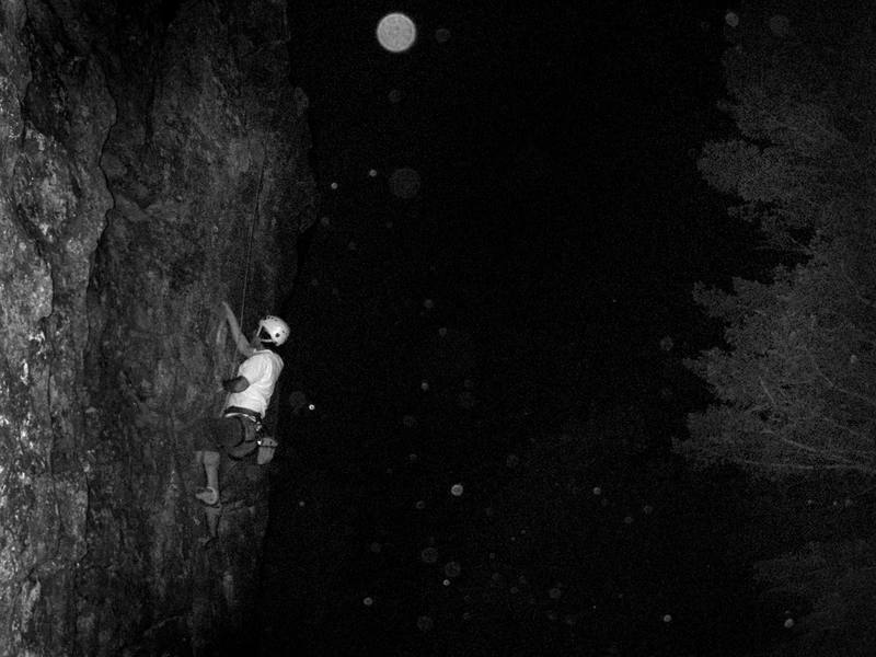 Joe night-climbing Unknown 5.8, 3 bolts. 2-bolt lowering anchor. Punk Rock, Aug. 2007.