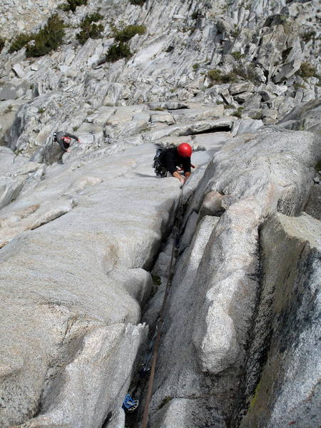 Jeff past the crux section of pitch 2, getting into the wide 5.7 stretch.