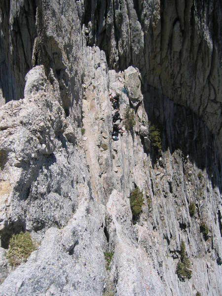 View down the South Summit crux pitch. A group of 3 simul climbers stop to eat lunch before hitting up the crux pitch. (8-13-07)