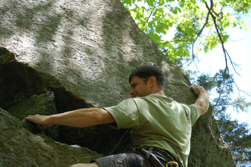 Me trying to muscle through the crux (unsuccessfully.) Photo by Bryce Dalhaus