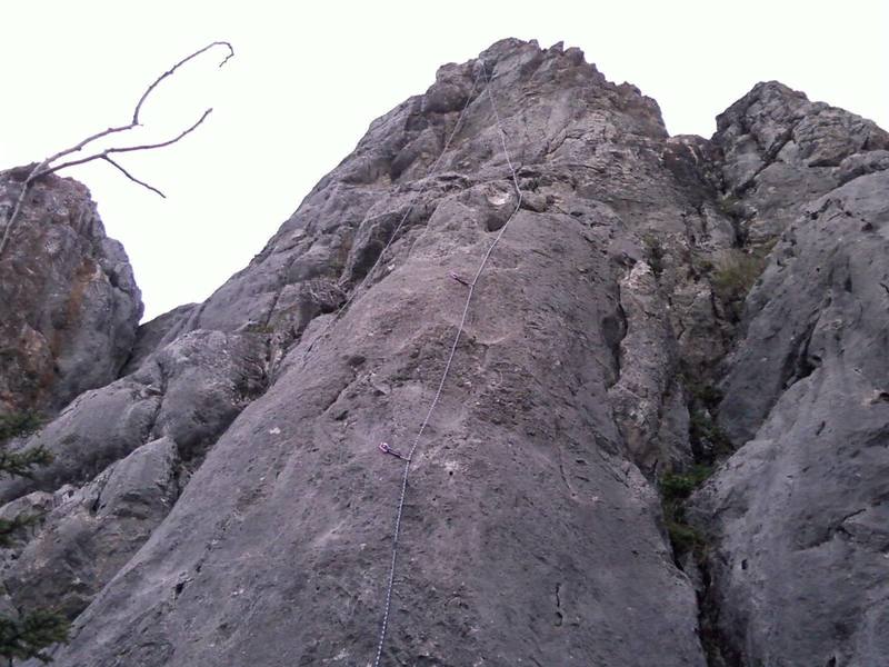 Sandbag follows the rope up the rounded arete to the steep finish.