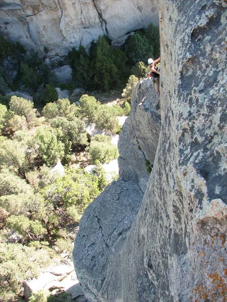 Maura Hahnenberger just before going around the corner on the upper section of the Classic Route on the Lost Arrow Spire.