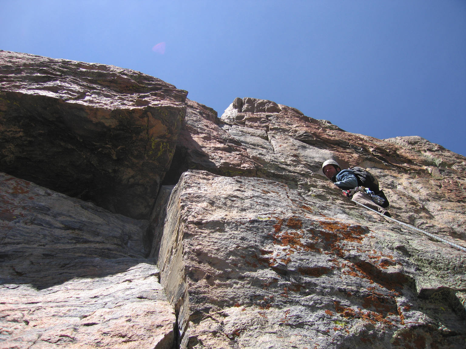 Brett leads the crux pitch of the South Face, Petit Grepon.