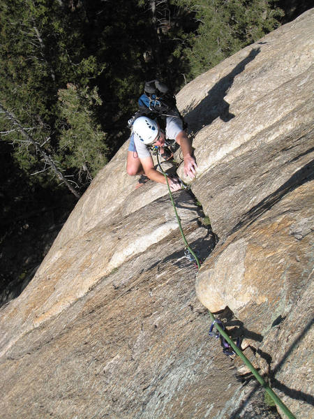 Working the crack above the 5.11 crux on the first pitch of "Question of Balance". August 2007.