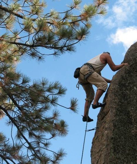 Chris topping out on Powder Keg (5.10a), Holcomb Valley Pinnacles