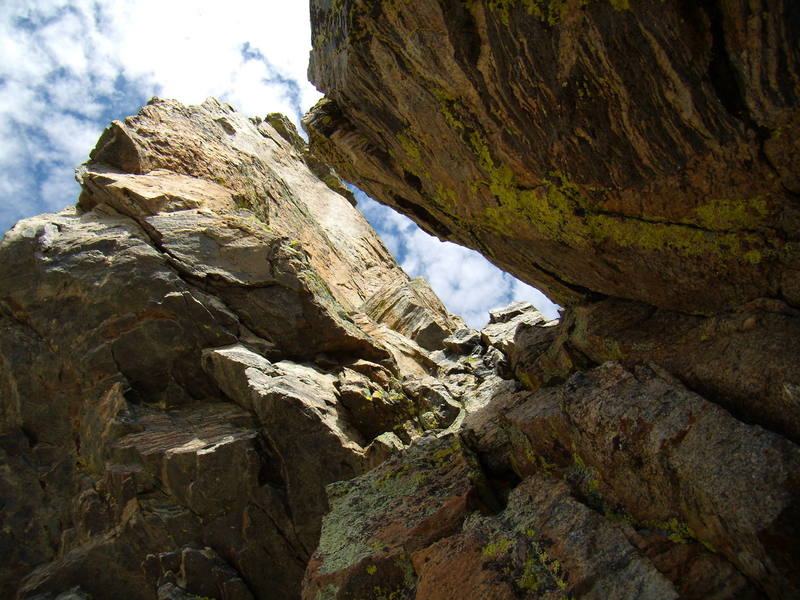 Moving up through the notch. A very nice pitch, and a rope stretcher to the top from here. Petit Grepon, SW Corner. Sept 2007.