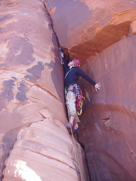 Matt on pitch 4, this is a great handcrack through the roof. <br>
<br>
The pitch later become 2-3 bolts, then free climbing, couple more bolts free climbing etc.