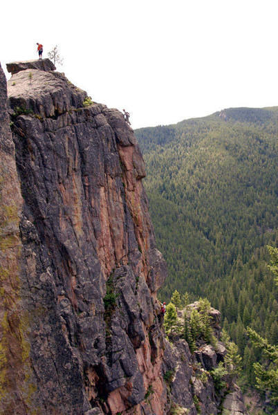 Pat topping out pitch 2. Climber in the background is on getting ready to do the standard rappel of the Walt's 2nd tier, also the decent for Paso...