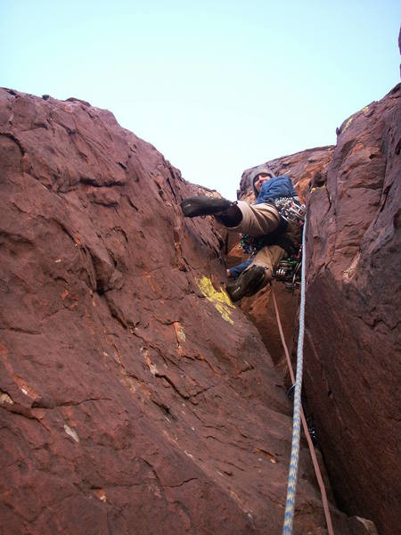 Andrew Gomoll leads up the primo second pitch chocolate rock and lime-colored lichen.