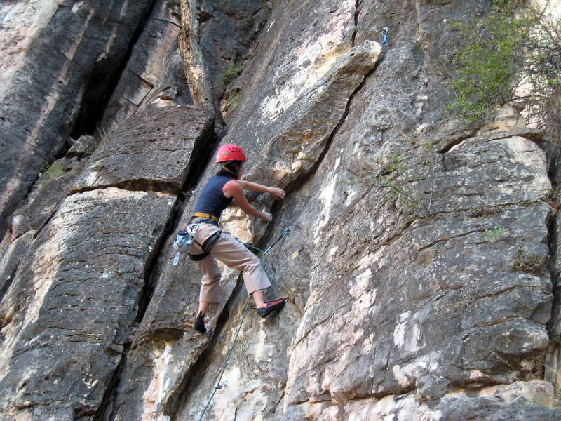 Making the super nice layback moves down low on the route.