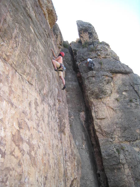 A busy day in the shade for good reason. Allison above the crux of the route and reaching for glory.