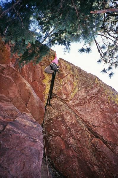 Tony Bubb finnishes up the roof crux of 'Far Out' (5.10d) on the back side of Ridge-2 in Skunk Canyon (Flatirons). Photo by Joseph Crotty, 8/07.