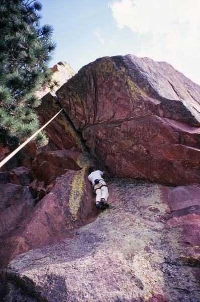 Joseph Crotty gets ready to start up the roof of 'Far Out' (5.10d) on the back side of Ridge-2 in Skunk Canyon (Flatirons). Photo by Tony Bubb, 8/07.
