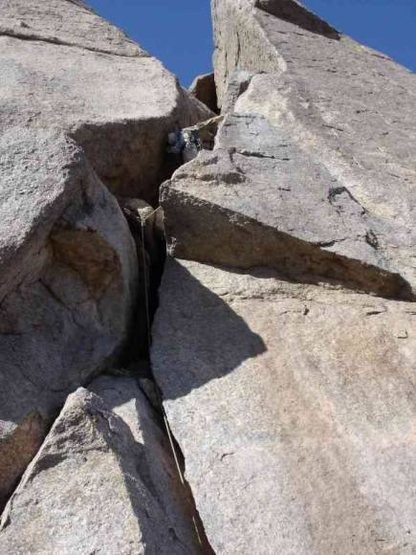 Start of the second pitch. The unknown climber is almost to the intermediate set of belay bolts.