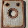 Faceplate of an Ansco Shur-Shot camera (circa 1930's) found at the base of Crystal Crag above Mammoth Lakes, CA 