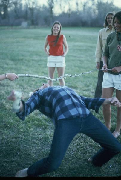 John Pearson showing the 70s version of multi-tasking....simultaneously doing 16 oz. curls and limbo!