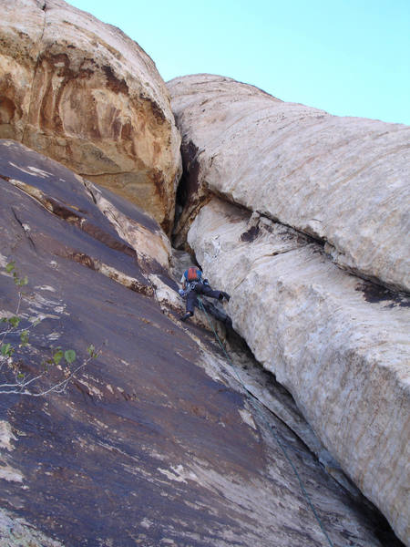 Jonny on the chimney/roof pitch. <br>
We climbed this route in 5 pitches with some simul-climbing.<br>
<br>
(Taken 10/3/07)