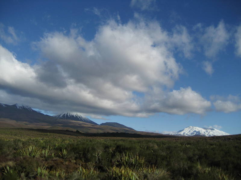 The 3 snow-covered volcanoes of Tongariro National Park on the North Island.  On the far left is Mt. Tongariro; in the center is Mt. Ngauruhoe (aka Mt. Doom in Lord of the Rings); and on the right is Mt. Ruapehu which actually erupted the day before we arrived here.  This "minor volcanic event" sent ash and rocks 15,000 ft into the air...