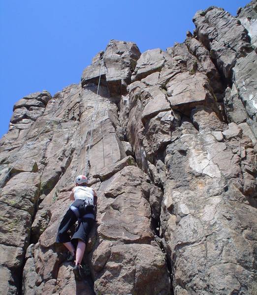 Help! What route is this climber on? I cannot figure it out. It's the Brown Cloud Crag area of North Table Mountain in Golden CO just east (right) of Oxymoron/Little-Ox, but I don't know how far east...maybe a few routes east.