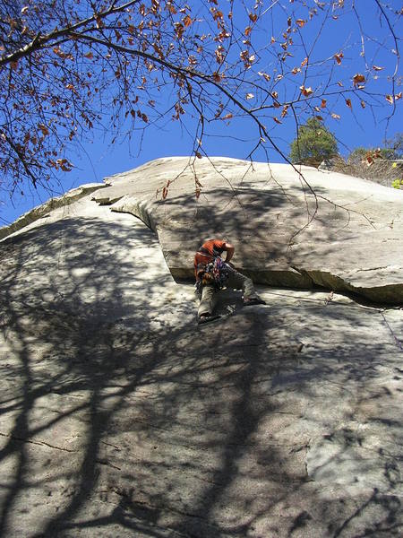 Rhett placing he last piece of gear before he embarks on the run out lieback section of Frosted Flake.