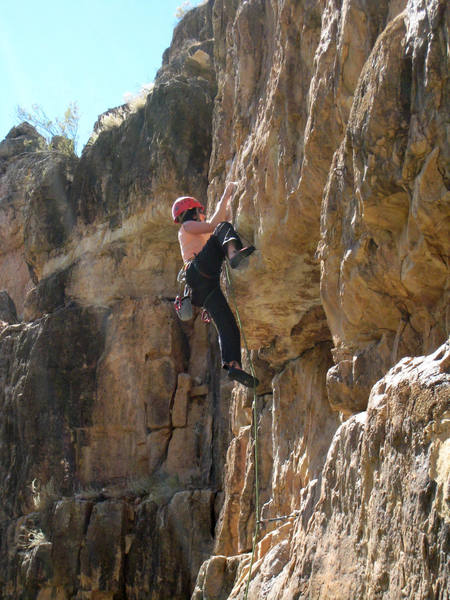 Pulling hard on the sharp holds above the roof and hoping the right foot doesn't pop off again and bruise the knee again. Oh, wait, that's how I do it...not how Allison here does it.