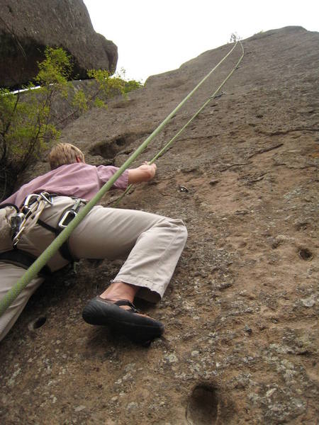 Flippin' sweet top-roping butt shot! Sorry. But it does show the face and route well. I'll be glad to delete this when someone adds a better action photo of the route.