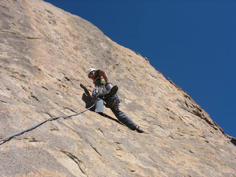 Mark starting up the third pitch. It traverses right to ascend the steep chickenheads on the right side of the photo. Easy climbing but don't fall or you'll kill your belayer!