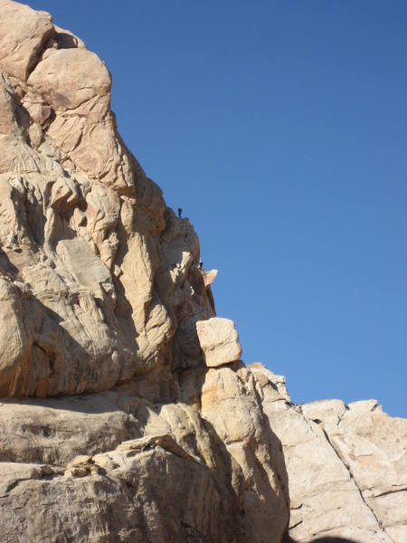 Tele/photo of Chris and Paul by Andy Ross. Paul on belay Chris starting pitch 3