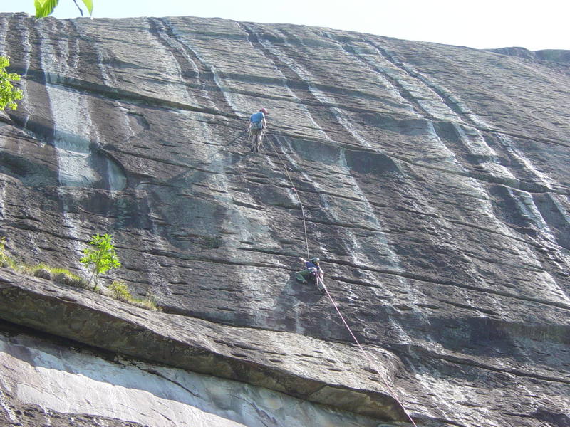 Brian Abram, belaying his wife Dana up the first pitch of Dinkus Dog on the South Side of Looking Glass. The route's a bit steeper than this photo's perspective makes it seem. The roof above the start is clearly visible.