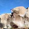 Making the long reach at the top of Undertow (V3), Joshua Tree NP